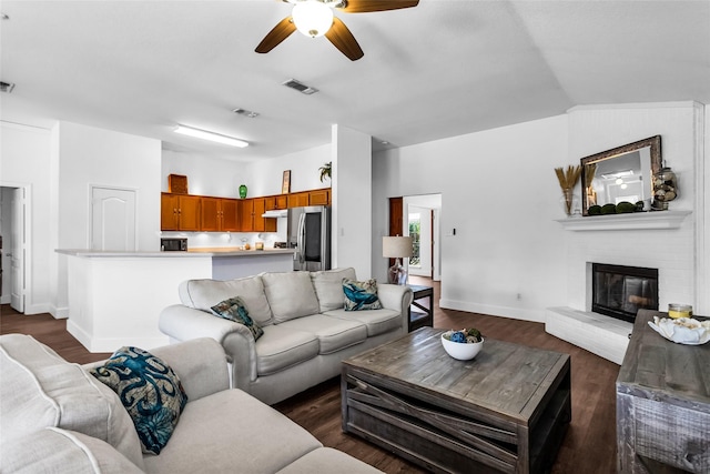 432 Maplegrove Rd, Cedar Hill, TX 75104 - living room featuring a ceiling fan, a fireplace, dark wood-type flooring, baseboards, and lofted ceiling