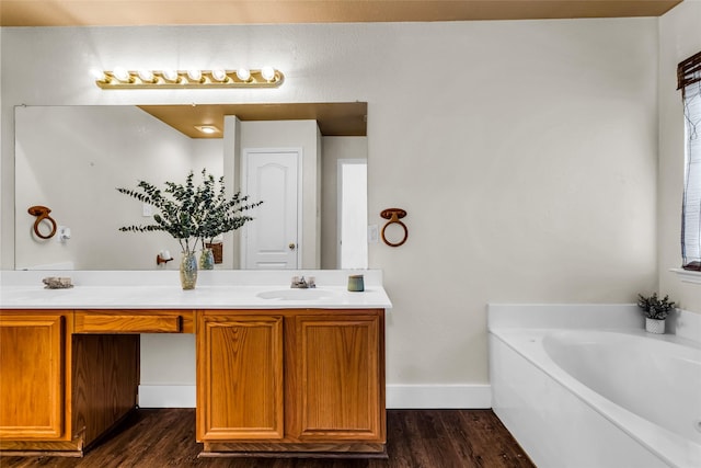 432 Maplegrove Rd, Cedar Hill, TX 75104 - full bathroom with double vanity, a garden tub, wood finished floors, and baseboards