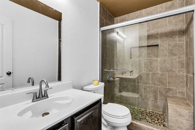 432 Maplegrove Rd, Cedar Hill, TX 75104 - full bath with toilet, a shower stall, vanity, and a textured wall