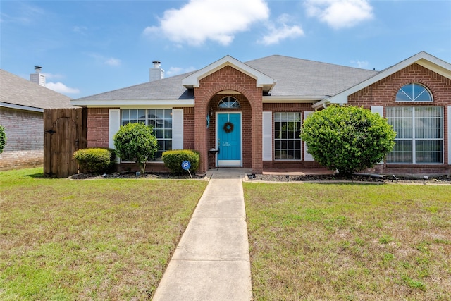 432 Maplegrove Rd, Cedar Hill, TX 75104 - view of front of house with brick siding, a front lawn, and roof with shingles