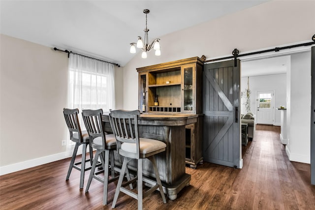432 Maplegrove Rd, Cedar Hill, TX 75104 - bar featuring a barn door, dark wood-style floors, baseboards, lofted ceiling, and hanging light fixtures