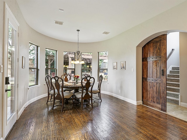701 Buffalo Springs Dr, Prosper, TX 75078 - dining room featuring arched walkways, wood finished floors, stairway, and baseboards