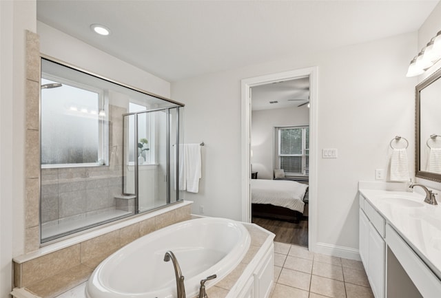 3909 Shrike Trl, Fort Worth, TX 76262 - ensuite bathroom with vanity, a bath, a shower stall, tile patterned floors, and ceiling fan