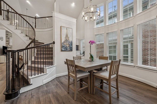 3909 Shrike Trl, Fort Worth, TX 76262 - dining room featuring high vaulted ceiling, a chandelier, wood finished floors, baseboards, and stairway