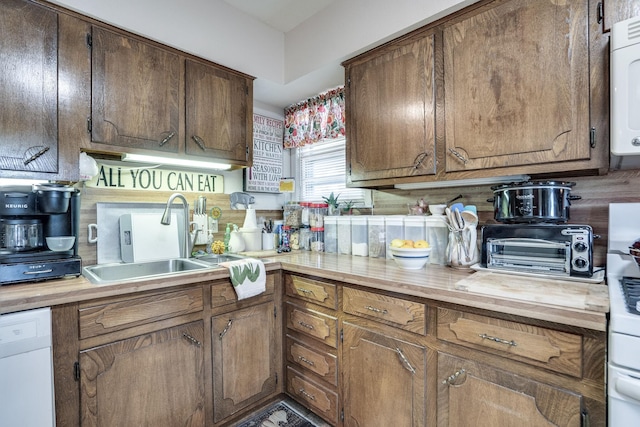 201 S Lake Dallas Dr, Lake Dallas, TX 75065 - kitchen featuring a sink and white dishwasher