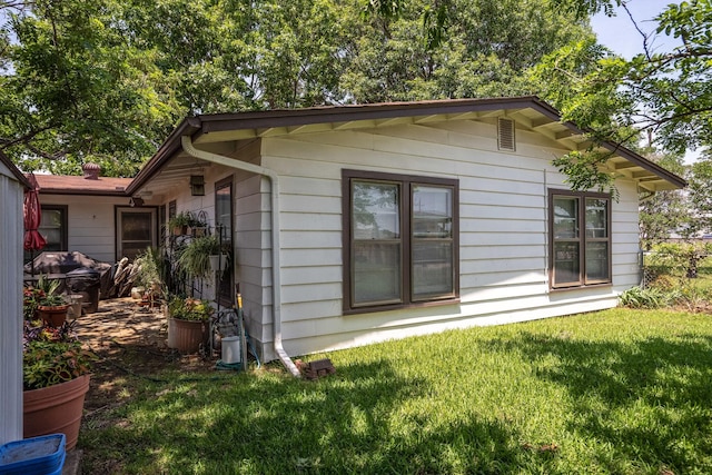 201 S Lake Dallas Dr, Lake Dallas, TX 75065 - view of home's exterior featuring a lawn