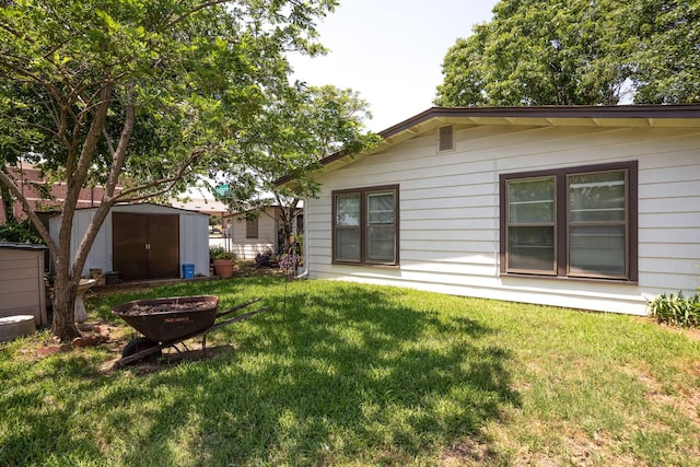 201 S Lake Dallas Dr, Lake Dallas, TX 75065 - view of grassy yard with a fire pit