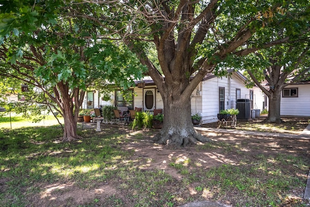 201 S Lake Dallas Dr, Lake Dallas, TX 75065 - view of property hidden behind natural elements with central AC unit