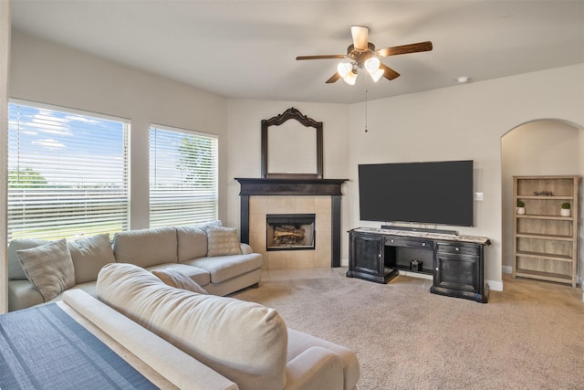 104 Laurel Oak Dr, Red Oak, TX 75154 - living area featuring a ceiling fan, light colored carpet, a tiled fireplace, and baseboards