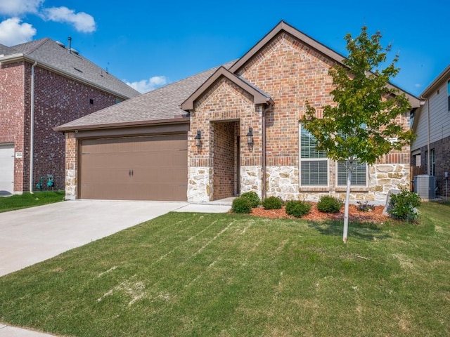 2912 Brady Starr Dr, Aubrey, TX 76227 - view of front of home featuring an attached garage, a front lawn, concrete driveway, brick siding, and stone siding