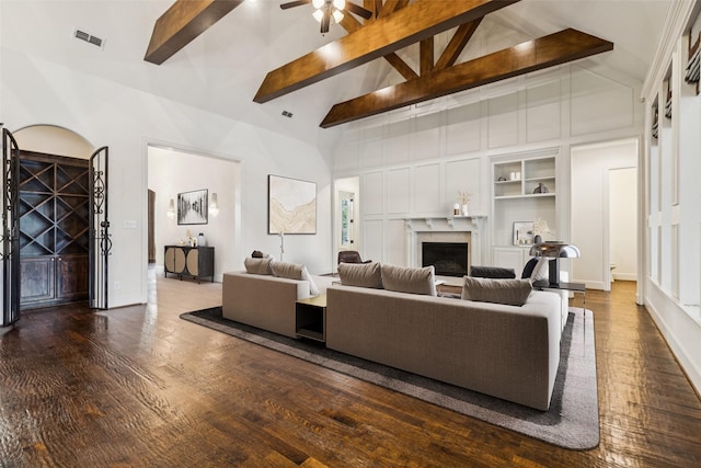 3708 Ledgestone Ct, Richardson, TX 75082 - living room with a ceiling fan, wood finished floors, beam ceiling, a fireplace, and built in shelves