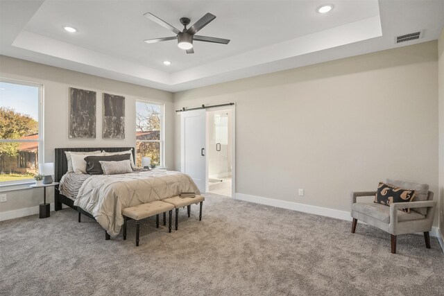 1621 S Chisholm Trl, Granbury, TX 76048 - carpeted bedroom featuring a raised ceiling, recessed lighting, baseboards, a barn door, and ensuite bath