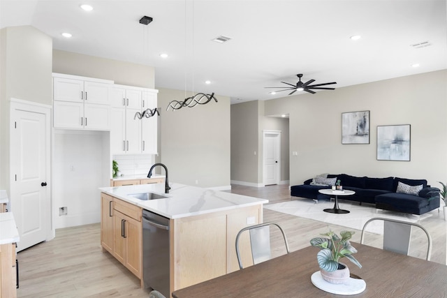 1621 S Chisholm Trl, Granbury, TX 76048 - kitchen featuring a sink, open floor plan, light wood-style flooring, stainless steel dishwasher, and a ceiling fan