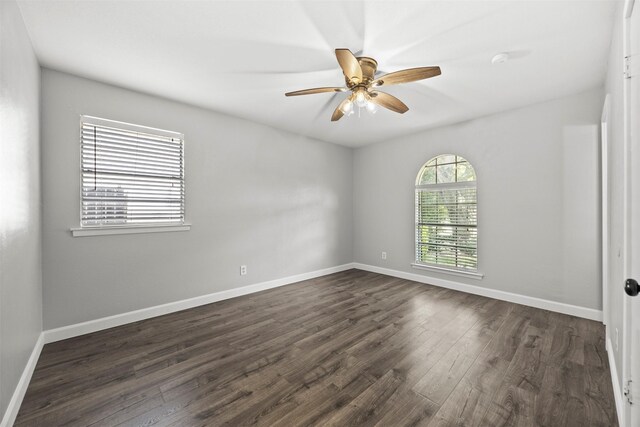 512 Judith St, Burleson, TX 76028 - spare room featuring dark wood-type flooring, ceiling fan, and baseboards