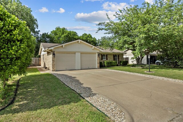 512 Judith St, Burleson, TX 76028 - single story home with an attached garage, driveway, and brick siding