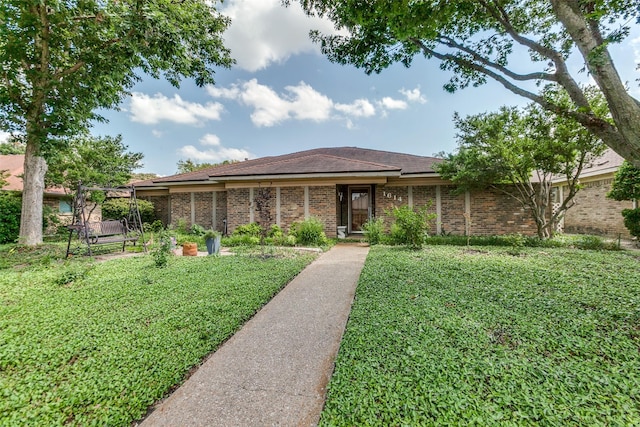 1614 Windsong Trl, Richardson, TX 75081 - ranch-style home with a front lawn and brick siding