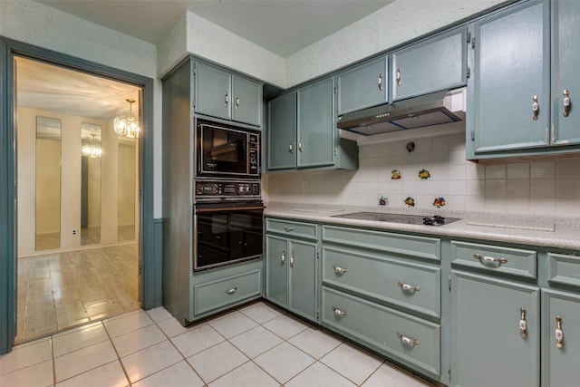 1614 Windsong Trl, Richardson, TX 75081 - kitchen featuring black appliances, under cabinet range hood, decorative backsplash, light countertops, and a chandelier