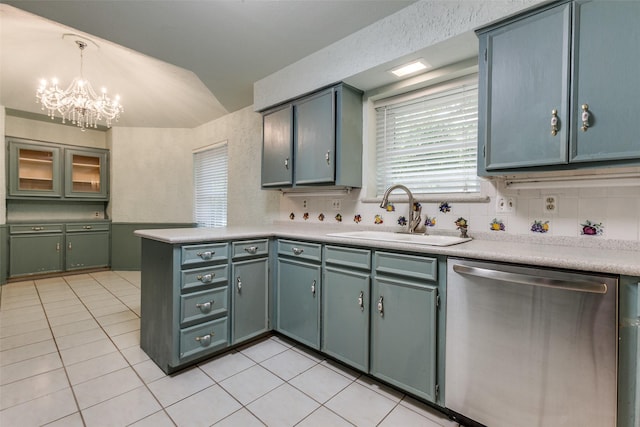 1614 Windsong Trl, Richardson, TX 75081 - kitchen featuring stainless steel dishwasher, lofted ceiling, light tile patterned floors, a peninsula, and a chandelier