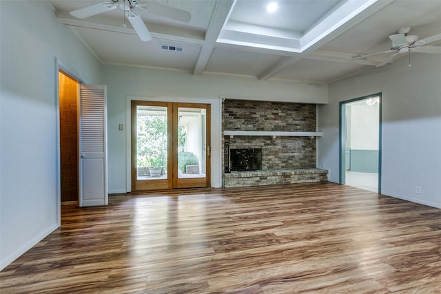1614 Windsong Trl, Richardson, TX 75081 - unfurnished living room with ceiling fan, wood finished floors, coffered ceiling, beam ceiling, and a brick fireplace