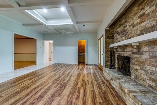 1614 Windsong Trl, Richardson, TX 75081 - unfurnished living room featuring a fireplace, coffered ceiling, wood finished floors, beamed ceiling, and ceiling fan