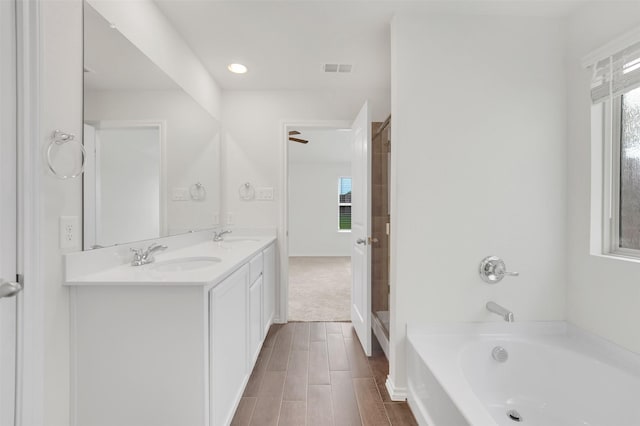 4311 Cordata Dr, Melissa, TX 75454 - full bathroom featuring a garden tub, double vanity, plenty of natural light, a shower, and recessed lighting