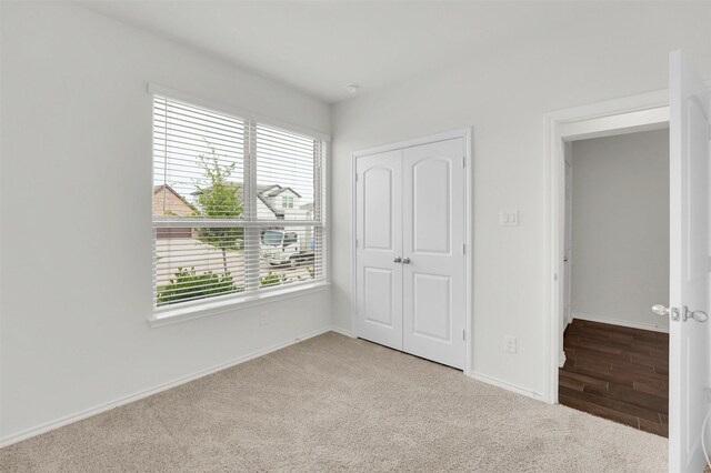 4311 Cordata Dr, Melissa, TX 75454 - unfurnished bedroom featuring carpet flooring, a closet, and baseboards