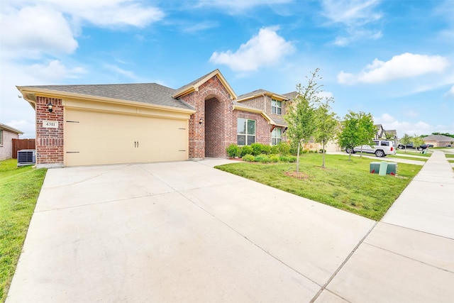 4311 Cordata Dr, Melissa, TX 75454 - traditional-style house with brick siding, central AC, concrete driveway, a front lawn, and a garage