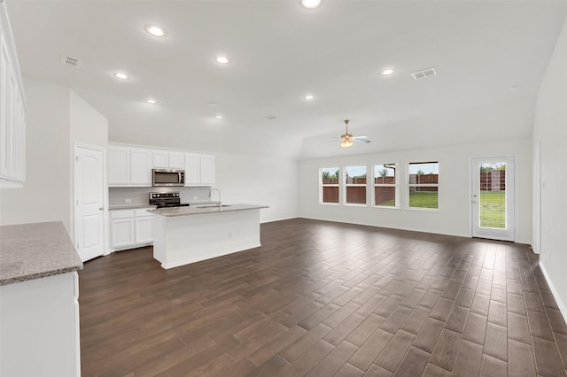 4311 Cordata Dr, Melissa, TX 75454 - kitchen featuring stainless steel microwave, electric range oven, healthy amount of natural light, a ceiling fan, and recessed lighting