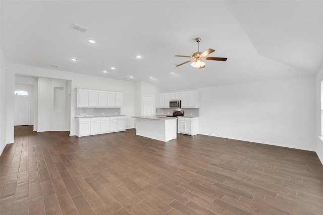 4311 Cordata Dr, Melissa, TX 75454 - unfurnished living room featuring vaulted ceiling, ceiling fan, dark wood-type flooring, baseboards, and recessed lighting