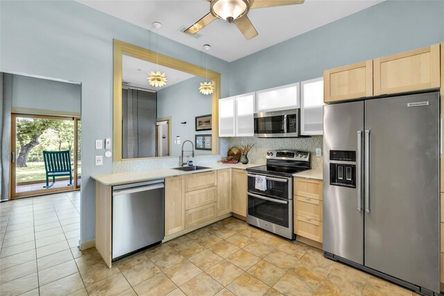 1212 Porter Rd, Bartonville, TX 75022 - kitchen with appliances with stainless steel finishes, light brown cabinetry, a sink, light countertops, and backsplash