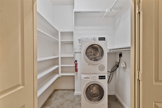 1212 Porter Rd, Bartonville, TX 75022 - washroom featuring stacked washing machine and dryer and baseboards