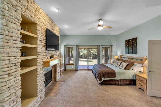 1212 Porter Rd, Bartonville, TX 75022 - bedroom featuring a fireplace, carpet floors, access to exterior, and ceiling fan