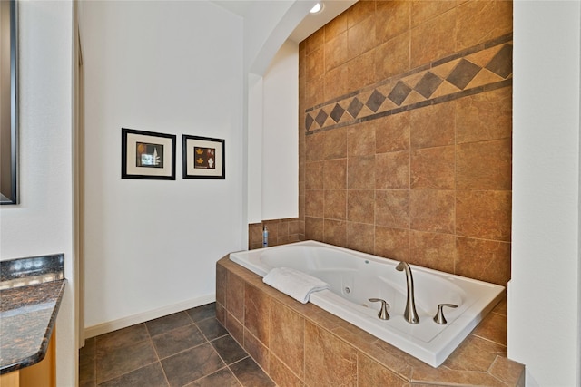 1212 Porter Rd, Bartonville, TX 75022 - bathroom featuring a tub with jets and baseboards