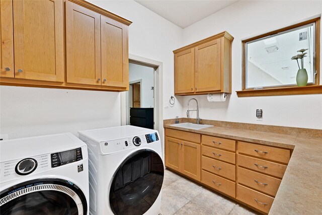 1212 Porter Rd, Bartonville, TX 75022 - laundry room featuring washer and clothes dryer, cabinet space, and light tile patterned floors