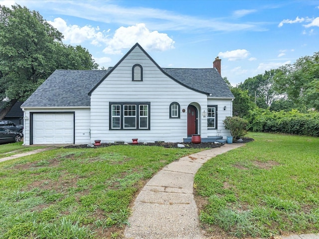 605 W Crockett St, Ennis, TX 75119 - view of front facade with roof with shingles, an attached garage, a chimney, and a front lawn