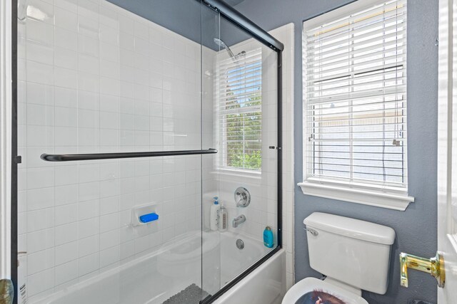 3804 Morning Dove Dr, Plano, TX 75025 - full bathroom with shower / bath combination with glass door and toilet
