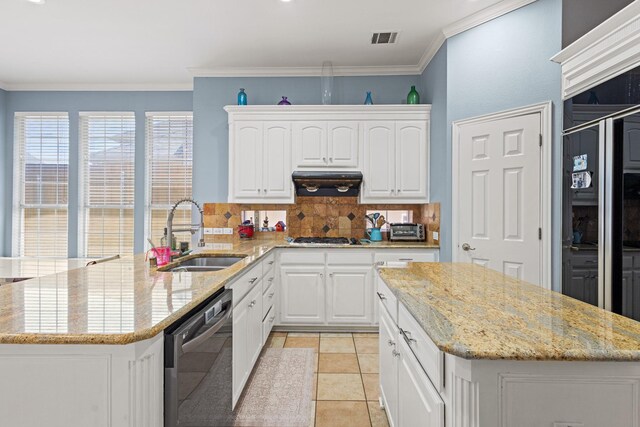 3804 Morning Dove Dr, Plano, TX 75025 - kitchen with stainless steel dishwasher, a sink, tasteful backsplash, a peninsula, and white cabinetry