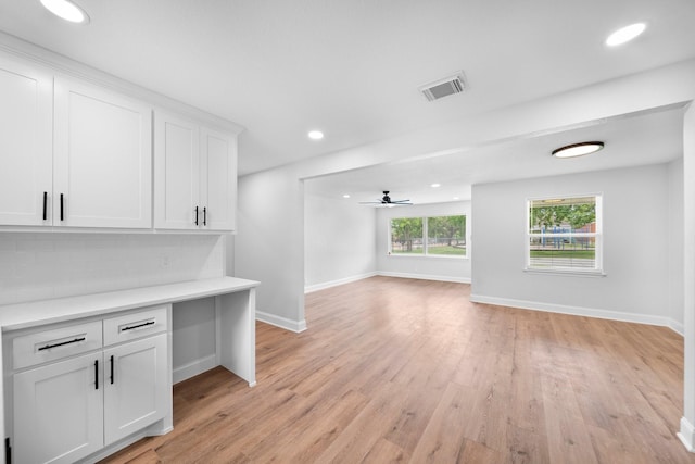 2415 Falls Dr, Dallas, TX 75211 - unfurnished living room featuring baseboards, light wood finished floors, and recessed lighting