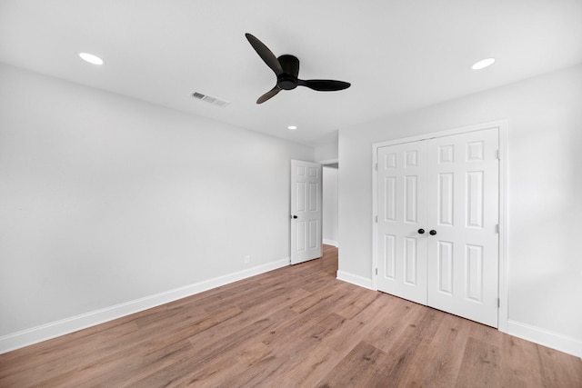 2415 Falls Dr, Dallas, TX 75211 - unfurnished bedroom with light wood-type flooring, baseboards, a closet, recessed lighting, and a ceiling fan