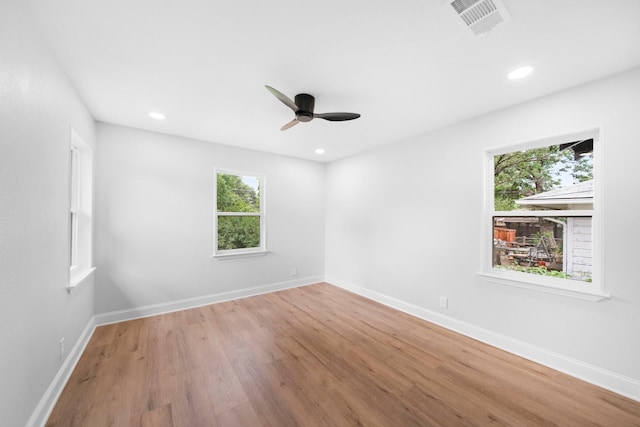 2415 Falls Dr, Dallas, TX 75211 - spare room with wood finished floors, a ceiling fan, recessed lighting, and baseboards