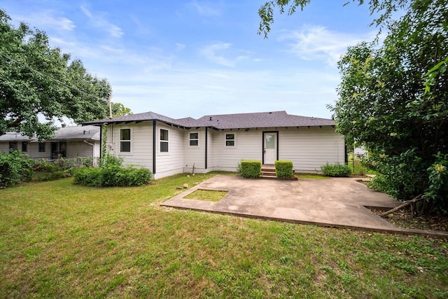 2415 Falls Dr, Dallas, TX 75211 - rear view of house with a patio area and a yard