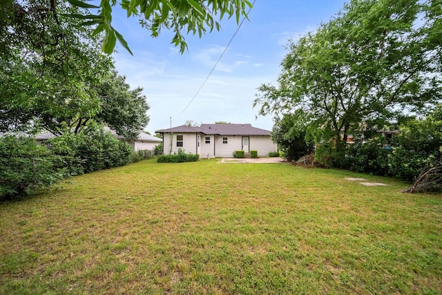2415 Falls Dr, Dallas, TX 75211 - view of green lawn featuring a patio area