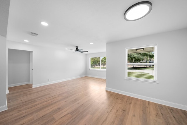 2415 Falls Dr, Dallas, TX 75211 - unfurnished room with light wood-type flooring, ceiling fan, baseboards, and recessed lighting