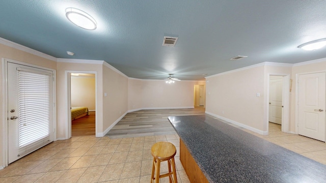 2008 Pine Knot Dr, Heartland, TX 75126 - unfurnished living room with ceiling fan, light tile patterned floors, baseboards, and crown molding