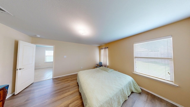 2008 Pine Knot Dr, Heartland, TX 75126 - bedroom featuring baseboards and light wood-style flooring