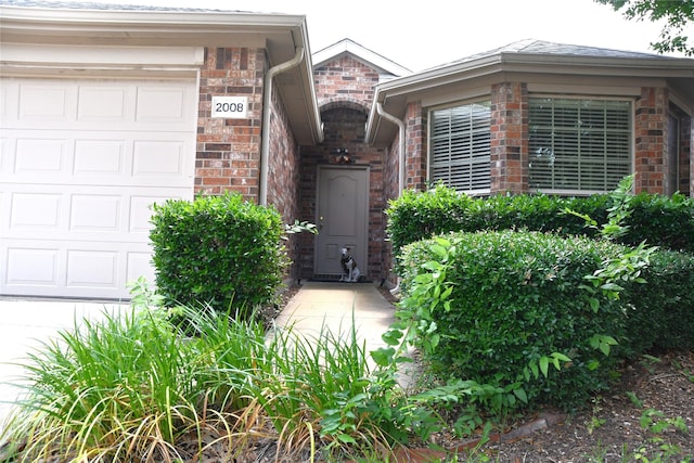 2008 Pine Knot Dr, Heartland, TX 75126 - entrance to property featuring a garage and brick siding