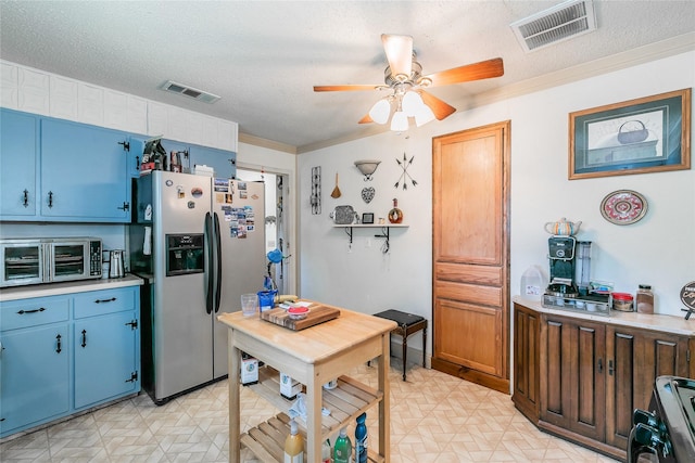1055 Miller Rd, Reno, TX 76020 - kitchen featuring stainless steel refrigerator with ice dispenser, light floors, ceiling fan, blue cabinetry, and a textured ceiling