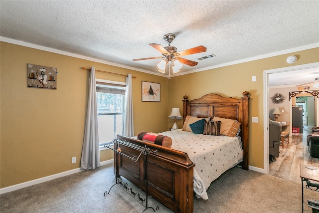 1055 Miller Rd, Reno, TX 76020 - carpeted bedroom featuring ornamental molding, a textured ceiling, baseboards, and a ceiling fan