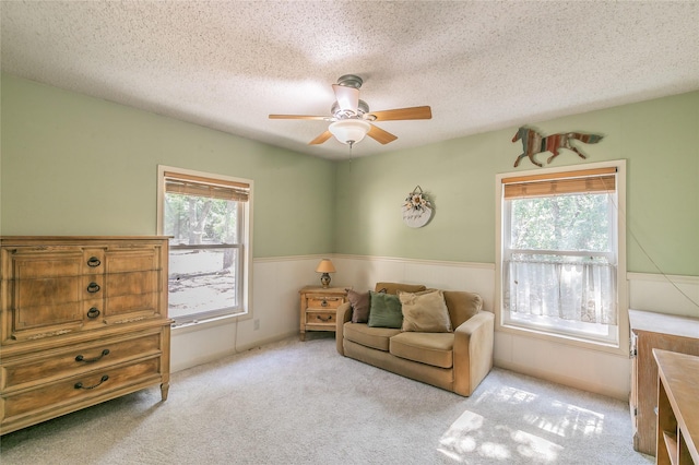 1055 Miller Rd, Reno, TX 76020 - sitting room with ceiling fan, a textured ceiling, and carpet floors