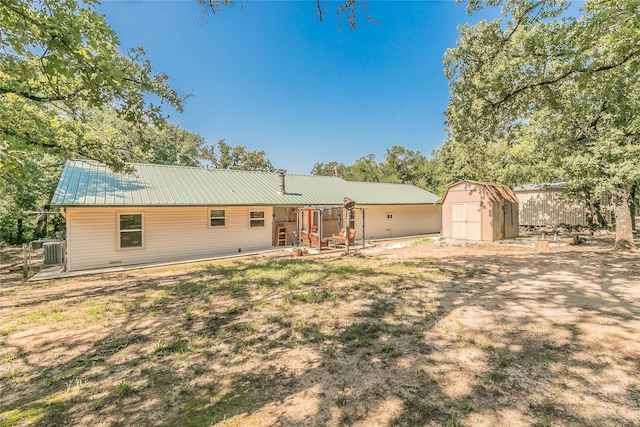 1055 Miller Rd, Reno, TX 76020 - back of house with metal roof, a patio area, and central AC